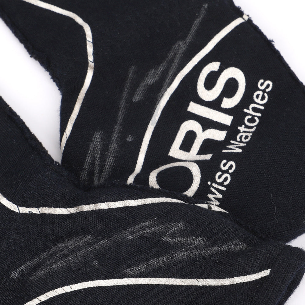 Close up of a Valtteri Bottas 2015 Black and white scarf with Oris logo on a white background